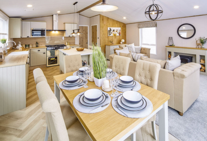 Open-plan kitchen with set dining table